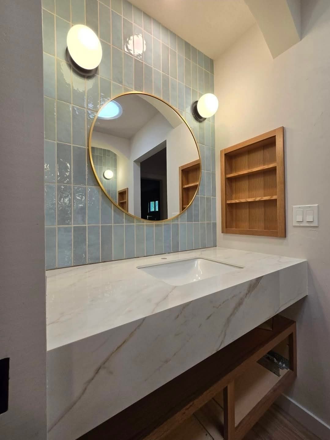 Floating marble vanity with sage tile