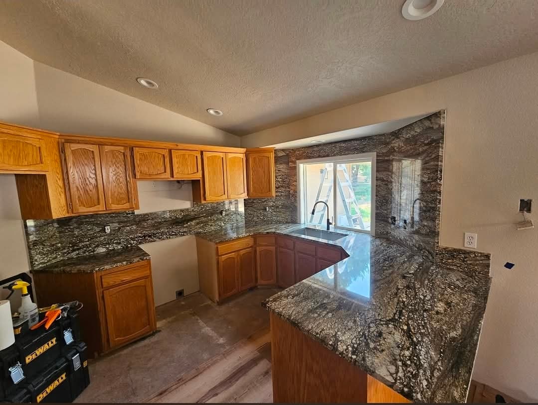 Dark granite with oak cabinets